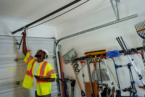 Professional Garage Door Roller Replacement technician working in Inwood, NY